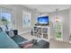 Relaxing living room featuring a comfortable couch, a TV, and a bookshelf at 2197 Sandy Point Ln, Mount Pleasant, SC 29466