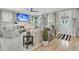 Bright living room with a fireplace, large windows, comfortable seating, and hardwood floors at 2197 Sandy Point Ln, Mount Pleasant, SC 29466