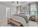 Bright and airy main bedroom featuring neutral decor and an ensuite bathroom at 2197 Sandy Point Ln, Mount Pleasant, SC 29466