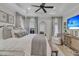 Bright main bedroom with a large bed, ensuite sitting area, and neutral decor at 2197 Sandy Point Ln, Mount Pleasant, SC 29466