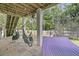 Covered patio with hammock chairs and a hammock, perfect for relaxing and enjoying the outdoors at 2197 Sandy Point Ln, Mount Pleasant, SC 29466