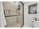 Modern tiled shower with glass door, built-in niche, and elegant fixtures at 2197 Sandy Point Ln, Mount Pleasant, SC 29466
