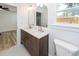 Bathroom boasts dual sinks, wood vanity, decorative mirrors and updated fixtures at 2219 Eagle Dr, North Charleston, SC 29406
