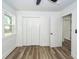 Bedroom featuring vinyl floors, closet, window, and doorway at 2219 Eagle Dr, North Charleston, SC 29406