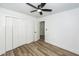 Spacious bedroom featuring vinyl floors, closet, ceiling fan, and doorway at 2219 Eagle Dr, North Charleston, SC 29406