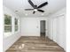 Bright bedroom with vinyl floors, a ceiling fan, two windows, and closet at 2219 Eagle Dr, North Charleston, SC 29406