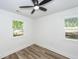 Bright bedroom with vinyl floors and two windows offering a view at 2219 Eagle Dr, North Charleston, SC 29406