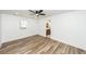 Bedroom featuring wood-look floors, ceiling fan, and a view of a bathroom at 2219 Eagle Dr, North Charleston, SC 29406
