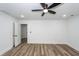 Bedroom with vinyl floors, ceiling fan, closet, and doorway at 2219 Eagle Dr, North Charleston, SC 29406