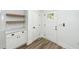 Entryway nook features custom cabinets, shelves, and white door at 2219 Eagle Dr, North Charleston, SC 29406