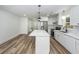 Bright, remodeled kitchen with stainless steel appliances, island, and hardwood floors at 2219 Eagle Dr, North Charleston, SC 29406
