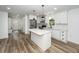 Bright, remodeled kitchen with stainless steel appliances, island, and hardwood floors at 2219 Eagle Dr, North Charleston, SC 29406