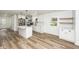 Bright, remodeled kitchen with stainless steel appliances, island, and hardwood floors at 2219 Eagle Dr, North Charleston, SC 29406