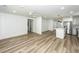 Open floor plan living room with light wood floors and a ceiling fan at 2219 Eagle Dr, North Charleston, SC 29406