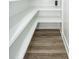 Walk-in pantry with white shelving and wood-look floors for efficient storage at 2219 Eagle Dr, North Charleston, SC 29406