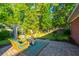 Relaxing backyard featuring a patio area with outdoor furniture and lush landscaping at 2324 High Tide Dr, Charleston, SC 29414