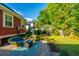 Inviting patio featuring outdoor seating with beautiful landscaping and hardscaping details at 2324 High Tide Dr, Charleston, SC 29414