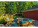 Inviting patio featuring outdoor seating, brick pavers, and lush greenery at 2324 High Tide Dr, Charleston, SC 29414