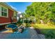 Inviting patio featuring outdoor seating with beautiful landscaping and hardscaping details at 2324 High Tide Dr, Charleston, SC 29414