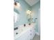 Dual sink bathroom with a white countertop, modern lighting, and a shower and tub combination at 2324 High Tide Dr, Charleston, SC 29414