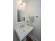 Bathroom featuring pedestal sink, framed mirror, decorative faucet, and towel bar at 2324 High Tide Dr, Charleston, SC 29414