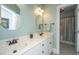 Bathroom featuring double sinks, framed mirrors and a shower and tub combo with a white countertop at 2324 High Tide Dr, Charleston, SC 29414