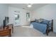 Bright bedroom featuring a daybed, TV, and access to a balcony through a glass door at 2324 High Tide Dr, Charleston, SC 29414