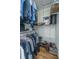 Organized walk-in closet featuring wire shelving, hanging clothes, shoes and hardwood floors at 2324 High Tide Dr, Charleston, SC 29414