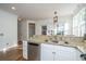 Kitchen with white cabinets, stainless steel appliances, granite countertop, and hardwood floor at 2324 High Tide Dr, Charleston, SC 29414