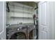 Laundry room featuring LG Thinq washer and dryer set, white shelves and door at 2324 High Tide Dr, Charleston, SC 29414