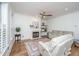 Bright living room features hardwood floors, a cozy fireplace, and comfortable seating with neutral decor at 2324 High Tide Dr, Charleston, SC 29414