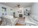Bright living room boasts hardwood floors, a cozy fireplace, and a comfortable seating area with neutral tones at 2324 High Tide Dr, Charleston, SC 29414