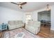 Open living room layout with hardwood floors, comfortable seating, and views into the kitchen and dining areas at 2324 High Tide Dr, Charleston, SC 29414