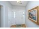 Bright foyer with hardwood floors, white trim, and decorative artwork at 2418 Tuscany Dr, North Charleston, SC 29406