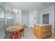Bright eat-in kitchen with island, tile floors, and breakfast table at 2418 Tuscany Dr, North Charleston, SC 29406