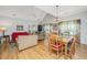 Open-concept living area with hardwood floors and vaulted ceilings at 2418 Tuscany Dr, North Charleston, SC 29406