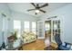Bright office space with a ceiling fan, natural light, and access to another room at 2418 Tuscany Dr, North Charleston, SC 29406