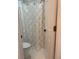 Small bathroom with toilet and shower featuring a white, decorative shower curtain at 255 Oak Point Landing Dr, Mount Pleasant, SC 29464