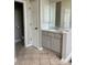 Well-lit bathroom featuring a single sink vanity with ample storage and a large mirror at 255 Oak Point Landing Dr, Mount Pleasant, SC 29464