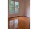 Bright bedroom with hardwood floors and large windows, providing plenty of natural light at 255 Oak Point Landing Dr, Mount Pleasant, SC 29464