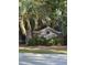 Elegant community sign for The Enclave, nestled amidst lush greenery and trees, providing a welcoming entrance at 255 Oak Point Landing Dr, Mount Pleasant, SC 29464