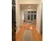 Bright foyer leads into living room with large windows, fireplace and hardwood floors at 255 Oak Point Landing Dr, Mount Pleasant, SC 29464