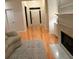 Foyer view leads into living room with fireplace, hardwood floors and white walls at 255 Oak Point Landing Dr, Mount Pleasant, SC 29464