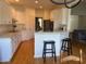 A bright and airy eat-in kitchen with granite counters, stainless appliances, and bar seating at 255 Oak Point Landing Dr, Mount Pleasant, SC 29464