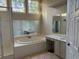 Bright and spacious main bathroom featuring a soaking tub, separate shower, and dual sink vanity at 255 Oak Point Landing Dr, Mount Pleasant, SC 29464