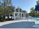Inviting community pool with ample seating, a spacious deck, and manicured landscaping for relaxation and leisure at 255 Oak Point Landing Dr, Mount Pleasant, SC 29464