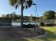 Community tennis courts with a vibrant blue surface surrounded by lush trees and greenery for an active lifestyle at 255 Oak Point Landing Dr, Mount Pleasant, SC 29464