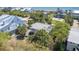 Aerial view of a home surrounded by lush trees in a neighborhood close to the beach at 2604 Palmetto Blvd, Edisto Island, SC 29438