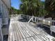 The back porch of a coastal home needs repairs or replacement at 2604 Palmetto Blvd, Edisto Island, SC 29438