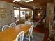 Inviting dining room and living room with wood paneling, perfect for casual beachside dining at 2604 Palmetto Blvd, Edisto Island, SC 29438